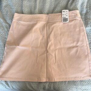 Light pink/blush skirt.